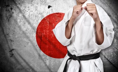 Photo sur Aluminium Arts martiaux combattant de karaté et drapeau du japon