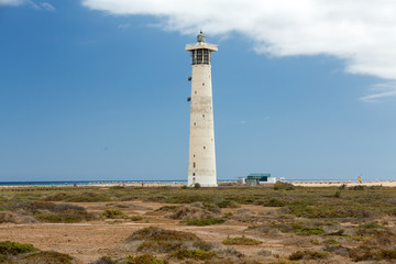 Fototapeta na wymiar Lighthouse on Playa del Matorral, Jandia Morro Jable, Fuerteventura Spain