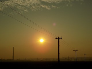 Fototapeta na wymiar Power line and sunset