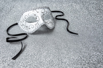 Carnival mask on shiny silver background. Mardi gras