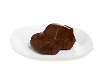 A sweet chocolate car on white plate