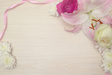 Lily on wooden background