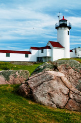 Fototapeta na wymiar Rock Looks Like Wave by Eastern Point lighthouse which was built on rocky terrain in Gloucester, Massachusetts.