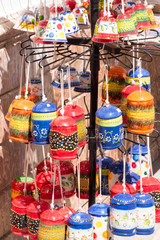 Fototapeta premium Pottery souvenirs hanging outside a shop in Mijas, Andalucia, Spain