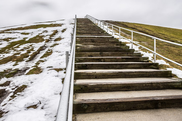 Steps to top of Mount Trashmore Park in Virginia Beach, Virginia with melting snow.