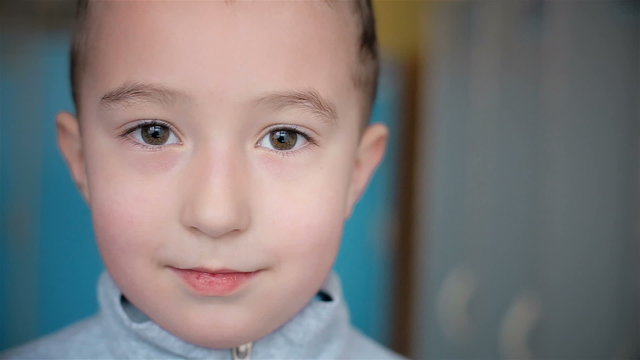 Looking in the camera beautiful boy of five