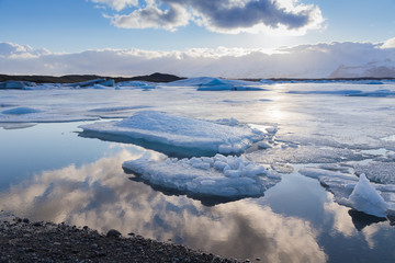 Jokulsarlon lake with reflection sky during late winter, Iceland © pranodhm