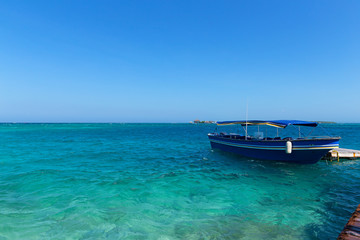 Tourist motorboat near del Rosario Islands, Colombia. Del Rosario Islands archipelago known as coral islands.