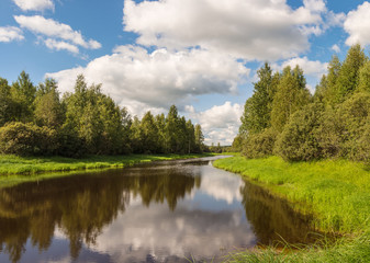 river with green banks