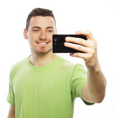 young man making photo of himself