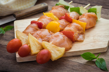 Raw barbecue on wooden cutting board
