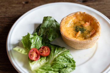 Salmon Quiche on White Plate (selective focus on quiche only)