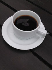 coffee cup on the black table