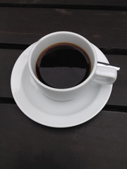 coffee cup on the black table