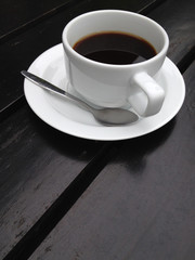 coffee cup on the black table