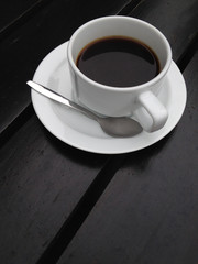 Obraz na płótnie Canvas coffee cup on the black table