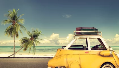 Selbstklebende Fototapeten Ozeanien Travel destination: vintage car parked near the beach with bags on a roof - Honeymoon trip  © jakkapan