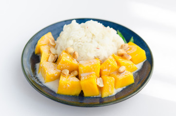 Sweet mango with sticky rice mix with coconut milk