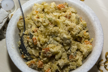 potato salad in a bowl with a spoon