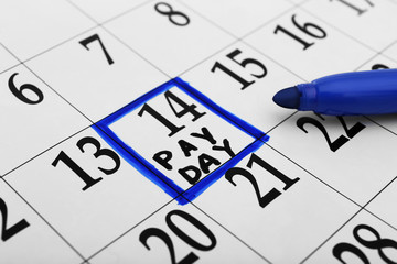 Payday concept. Calendar with blue felt pen background. Date in frame, close up