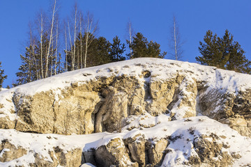 Fototapeta na wymiar winter landscape background on mountainside Kungur ice cave in the Urals