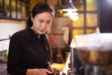 waitress serving in modern cafe