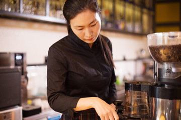 waitress serving in modern cafe