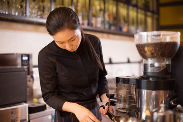 waitress serving in modern cafe