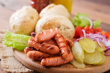Ingredients for making Hot dog - sandwich with pickles, red onions and lettuce