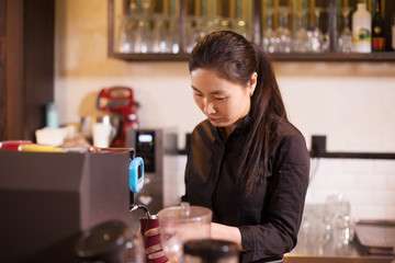 waitress serving in modern cafe