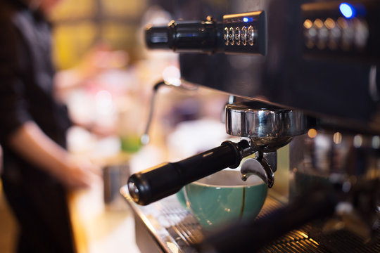 Waiter Serving In Modern Cafe