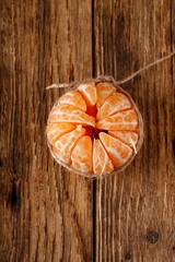 Bonded mandarin on old wooden table