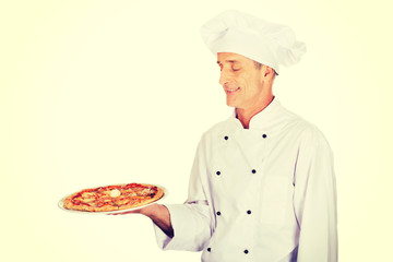 Chef baker with italian pizza