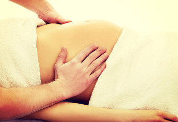 Pregnant woman having a relaxing massage