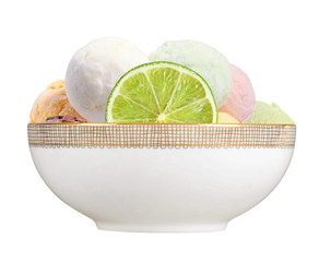 Scoop of fruit ice cream with lime slice in plate isolated on wh