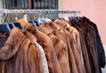 valuable fur coat in vintage style for sale in the flea market