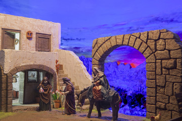Christmas Nativity scene. Mary and Joseph's search for a place t - obrazy, fototapety, plakaty