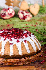 Celebratory cake decorated with  pomegranate and sugar icing
