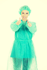 Woman surgeon doctor with thumbs up.