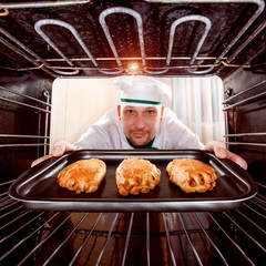 Chef cooking in the oven.