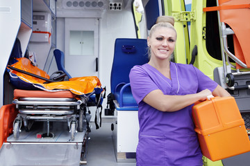 Female-nurse standing about ambulance © vera7388