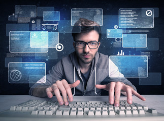 Nerd with glasses hacking websites