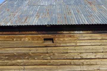 Timber wall and tin roof