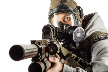  portrait of rebel with gas mask aiming with rifle
