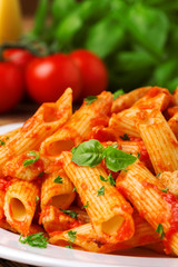 Penne with roasted chicken in tomato sauce