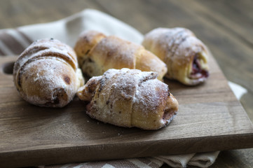 Baked croissants stuffed with jam