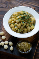 Close-up of italian gnocchi served with basil pesto, studio shot