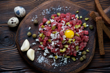 Close-up of beef steak tartare, studio shot, high angle view
