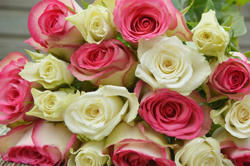 pink and white  roses on the wooden table.
pink and white flower for a special day