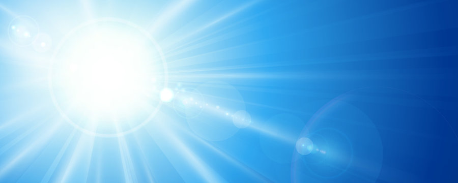 Blue sky with sun and lens flare